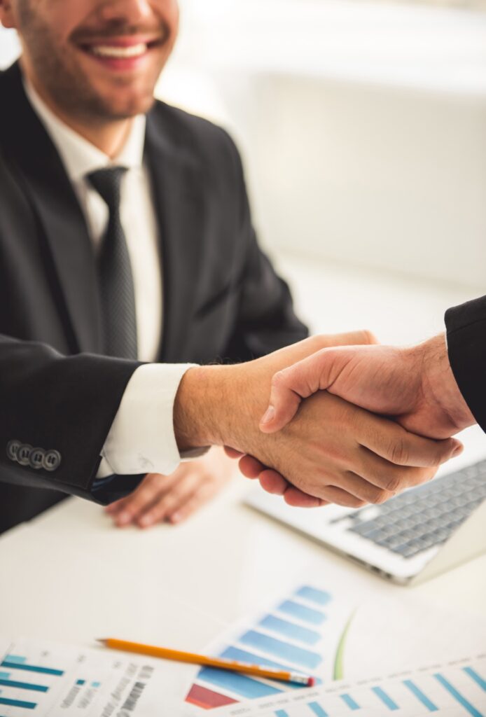 Insurance agent shaking hands with a client